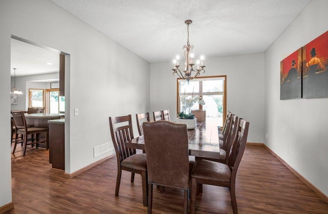 10695 184th Ave NW, Elk River, MN 55330 - dining area with a chandelier, dark wood-style flooring, and a textured ceiling