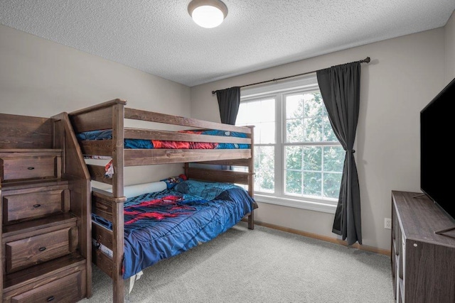 10695 184th Ave NW, Elk River, MN 55330 - carpeted bedroom featuring a textured ceiling and baseboards