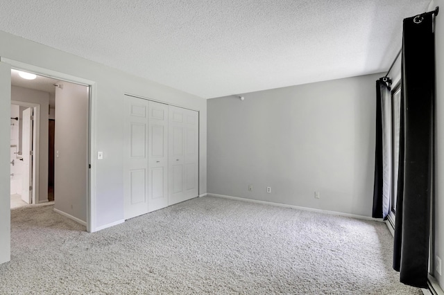 5643 Green Circle Dr Unit 107, Minnetonka, MN 55343 - unfurnished bedroom with carpet, a textured ceiling, and a closet