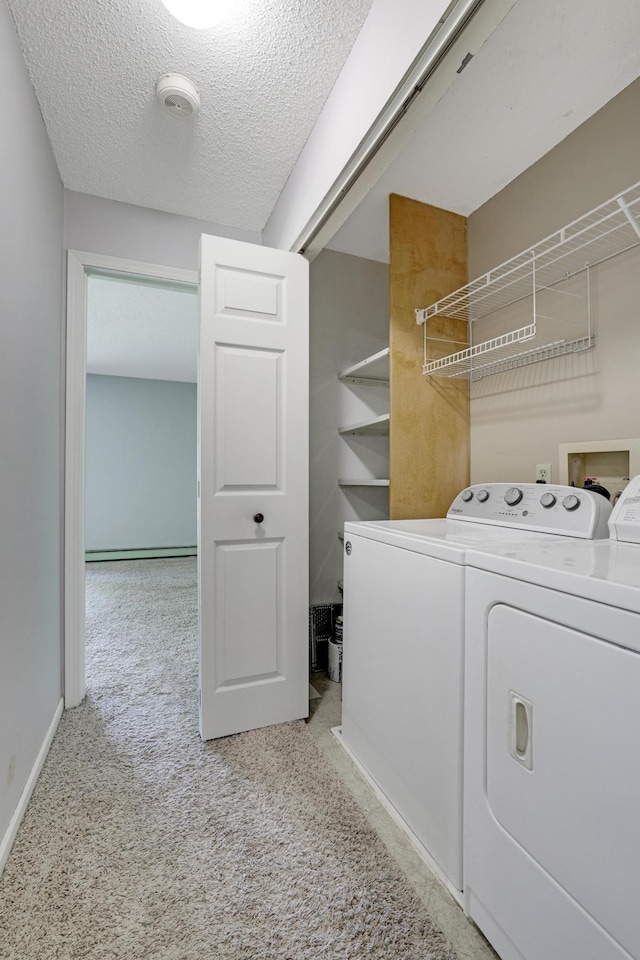 5643 Green Circle Dr Unit 107, Minnetonka, MN 55343 - laundry area featuring independent washer and dryer, carpet floors, and a textured ceiling