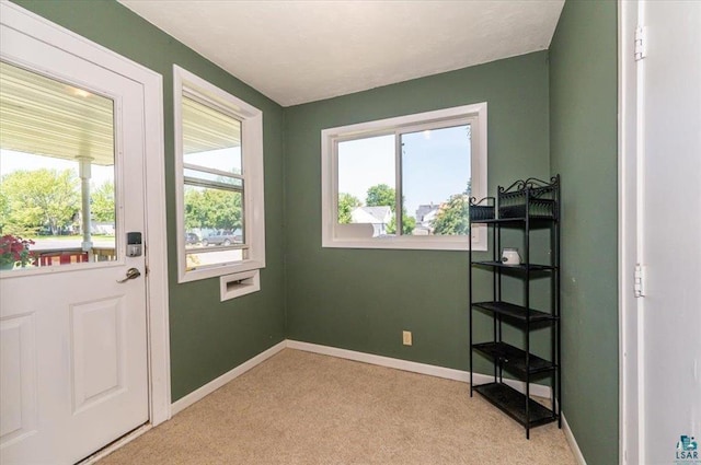 2014 5th St, Superior, WI 54880 - doorway to outside with light colored carpet and baseboards