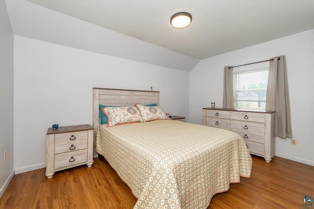 2014 5th St, Superior, WI 54880 - bedroom with wood finished floors and lofted ceiling