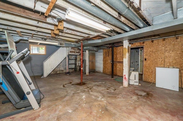 2014 5th St, Superior, WI 54880 - below grade area featuring fridge and stairs