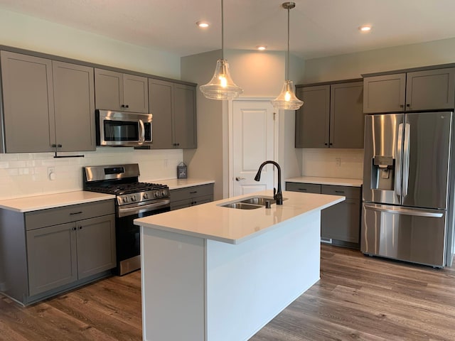 1248 100th Ave NW, Coon Rapids, MN 55433 - kitchen with appliances with stainless steel finishes, gray cabinets, decorative backsplash, recessed lighting, and dark wood-style flooring