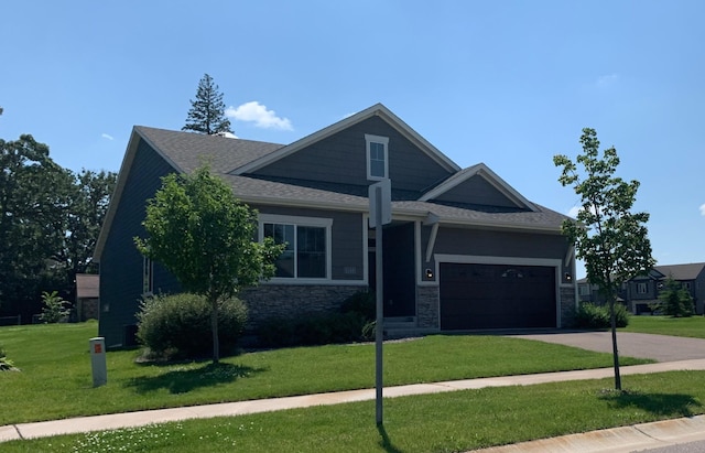 1248 100th Ave NW, Coon Rapids, MN 55433 - craftsman inspired home featuring driveway, a front lawn, a garage, and a shingled roof