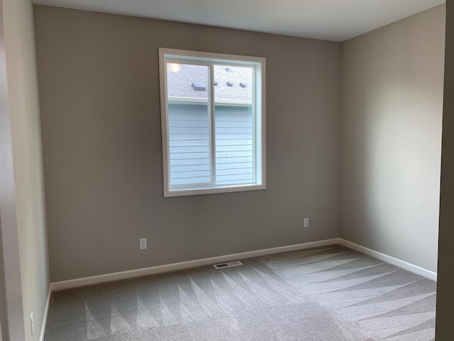 1248 100th Ave NW, Coon Rapids, MN 55433 - carpeted spare room featuring baseboards