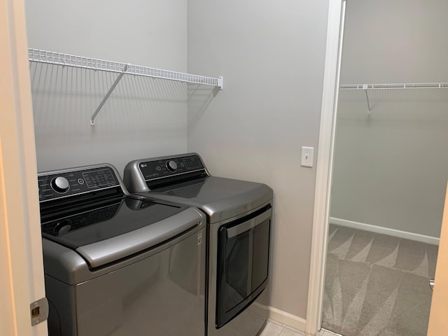 1248 100th Ave NW, Coon Rapids, MN 55433 - washroom with washer and clothes dryer and light colored carpet