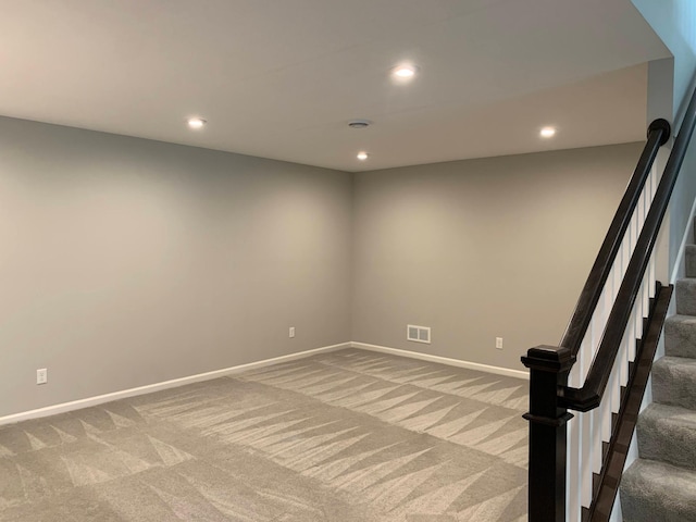 1248 100th Ave NW, Coon Rapids, MN 55433 - spare room featuring light colored carpet, recessed lighting, and stairway