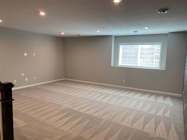 1248 100th Ave NW, Coon Rapids, MN 55433 - spare room with light colored carpet, recessed lighting, and a textured ceiling