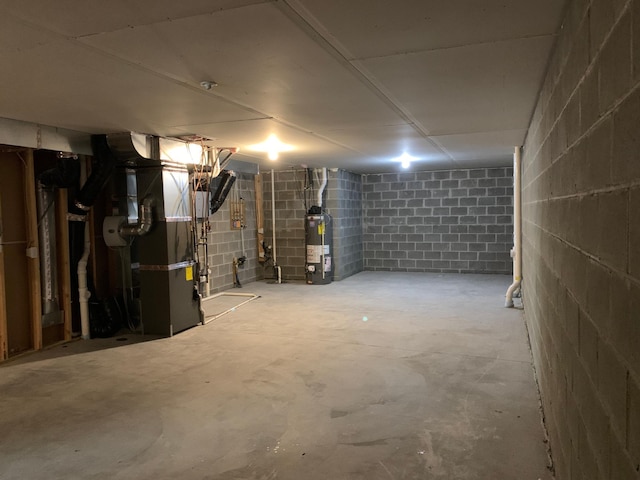 1248 100th Ave NW, Coon Rapids, MN 55433 - unfinished below grade area with water heater, heating unit, and concrete block wall