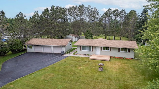 3661 Riley Rd, Rice Lake Twp, MN 55803 - single story home with an outdoor structure, a front yard, asphalt driveway, and a garage