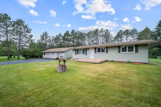 3661 Riley Rd, Rice Lake Twp, MN 55803 - ranch-style home with asphalt driveway, a wooden deck, and a front lawn
