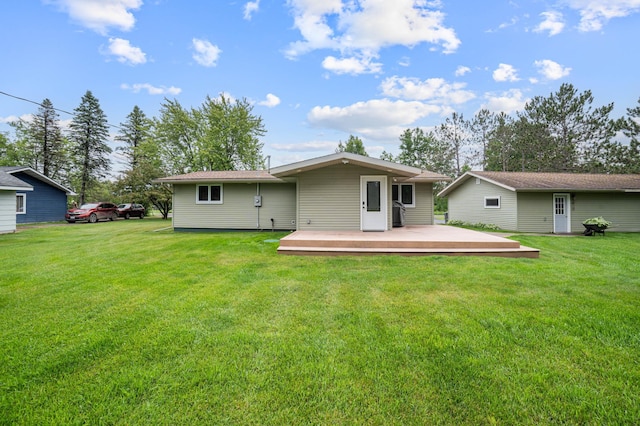 3661 Riley Rd, Rice Lake Twp, MN 55803 - back of house featuring a deck and a lawn