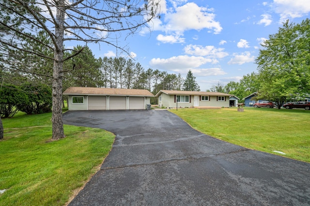 3661 Riley Rd, Rice Lake Twp, MN 55803 - ranch-style home featuring an outbuilding, asphalt driveway, and a front yard