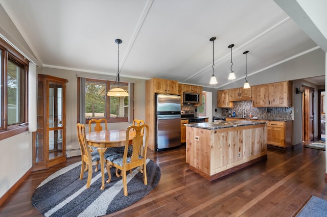3661 Riley Rd, Rice Lake Twp, MN 55803 - kitchen featuring appliances with stainless steel finishes, dark wood-style floors, dark countertops, decorative backsplash, and vaulted ceiling
