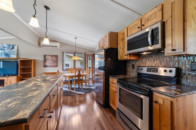 3661 Riley Rd, Rice Lake Twp, MN 55803 - kitchen featuring stainless steel appliances, decorative backsplash, dark wood finished floors, vaulted ceiling, and hanging light fixtures