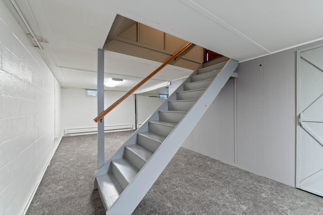 3661 Riley Rd, Rice Lake Twp, MN 55803 - stairway featuring concrete block wall, baseboard heating, and carpet