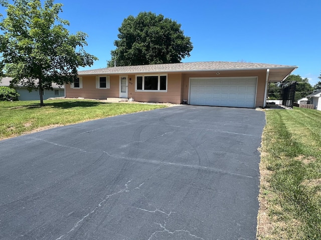 2724 Sunset Ln, Burnsville, MN 55337 - ranch-style house featuring asphalt driveway, a garage, and a front yard