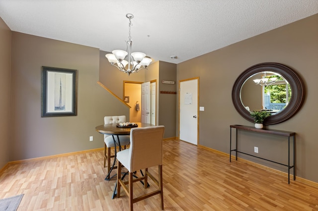 9605 Scott Cir N, Brooklyn Park, MN 55443 - dining room with a chandelier and light wood-type flooring