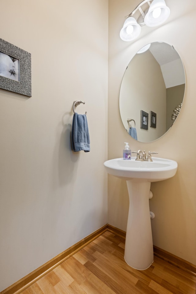 9605 Scott Cir N, Brooklyn Park, MN 55443 - bathroom featuring wood finished floors and baseboards