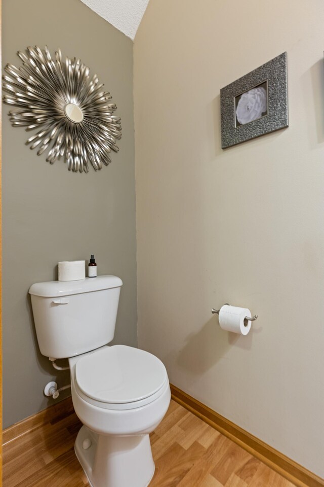 9605 Scott Cir N, Brooklyn Park, MN 55443 - bathroom with toilet and wood finished floors