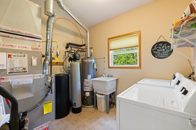 9605 Scott Cir N, Brooklyn Park, MN 55443 - utility room with washer and dryer, heating unit, and gas water heater