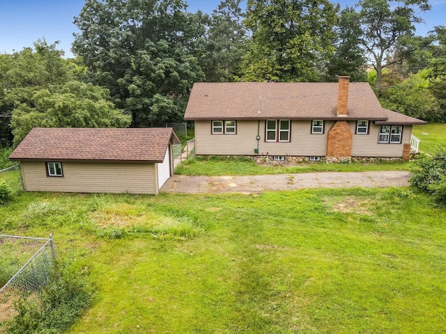 30867 Rasmussen Rd, Pequot Lakes, MN 56472 - rear view of house featuring a chimney, an outdoor structure, and a detached garage