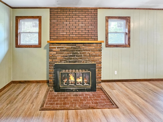 30867 Rasmussen Rd, Pequot Lakes, MN 56472 - detailed view of wood finished floors, a brick fireplace, and crown molding