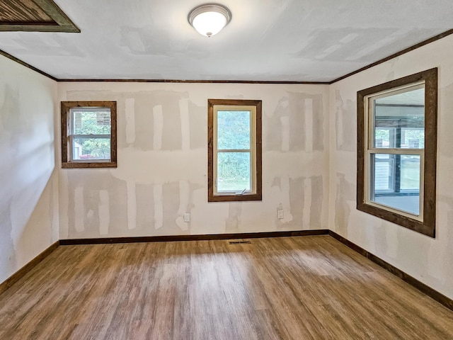 30867 Rasmussen Rd, Pequot Lakes, MN 56472 - spare room with wood finished floors and ornamental molding