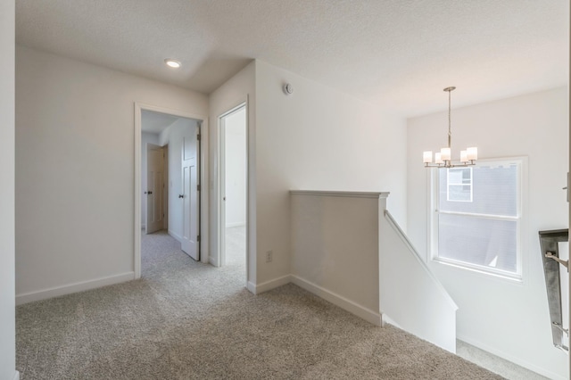 2550 Downing Ave, Shakopee, MN 55379 - empty room with a chandelier and carpet floors