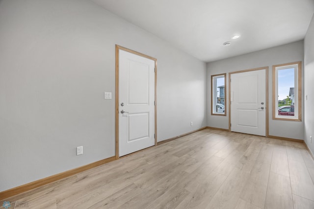 1057 61st Ave W, West Fargo, ND 58078 - entrance foyer with baseboards and light wood-style floors