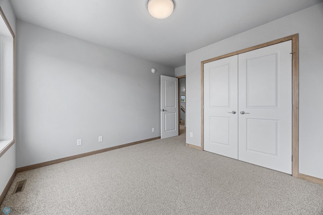 1057 61st Ave W, West Fargo, ND 58078 - unfurnished bedroom featuring carpet and a closet