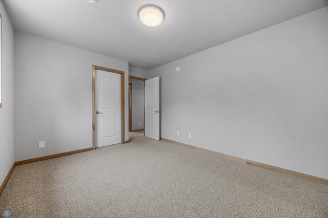 1057 61st Ave W, West Fargo, ND 58078 - empty room with light carpet and baseboards