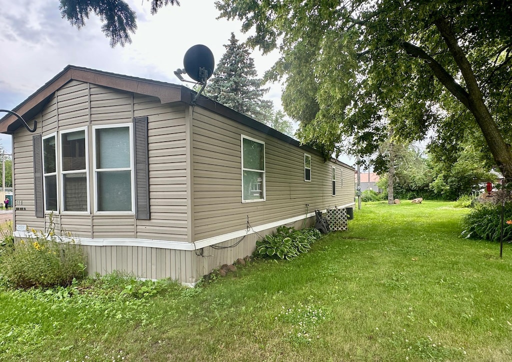 215 Lake St E, Isle, MN 56342 - view of side of property with a lawn