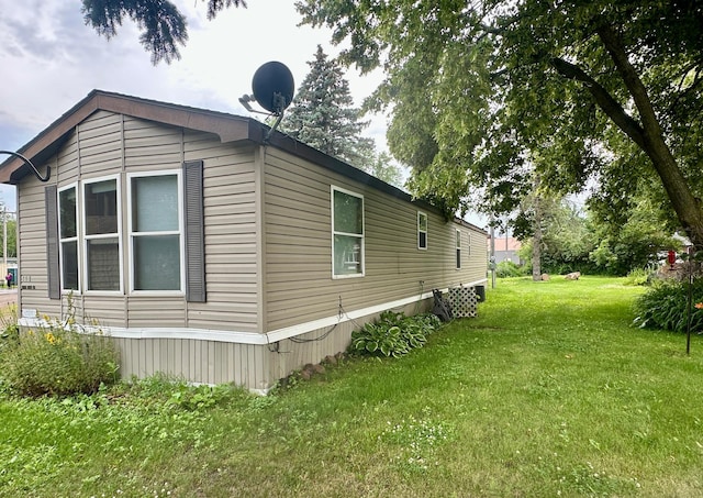 215 Lake St E, Isle, MN 56342 - view of side of property with a lawn