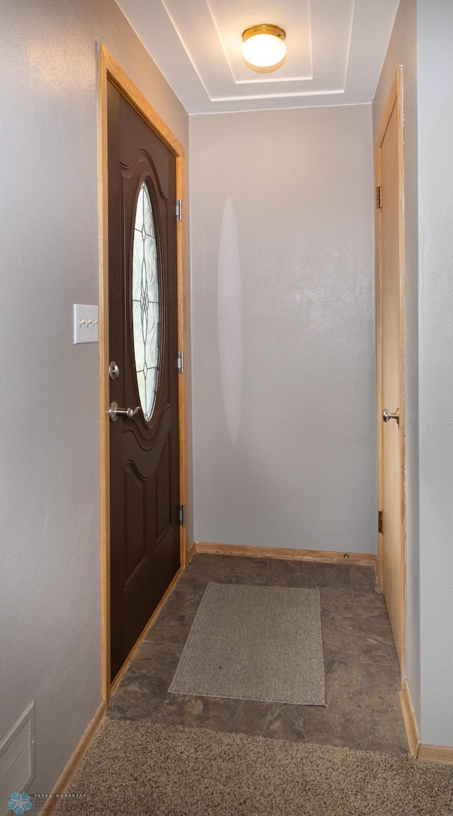 2510 10th St N, Fargo, ND 58102 - foyer featuring a tray ceiling and baseboards