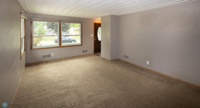 2510 10th St N, Fargo, ND 58102 - carpeted empty room featuring baseboards and crown molding