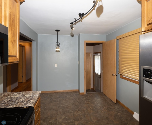 2510 10th St N, Fargo, ND 58102 - unfurnished dining area featuring baseboards