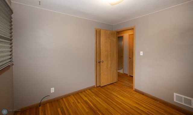 2510 10th St N, Fargo, ND 58102 - spare room with baseboards and light wood-style flooring
