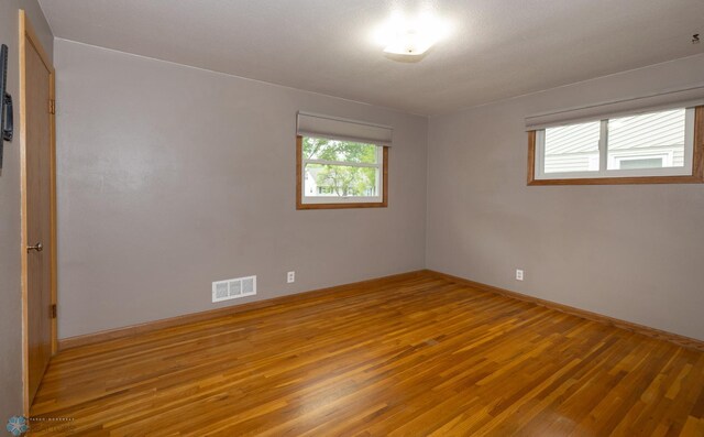 2510 10th St N, Fargo, ND 58102 - spare room with wood finished floors and baseboards