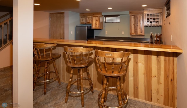 2510 10th St N, Fargo, ND 58102 - indoor wet bar with freestanding refrigerator, stairs, and recessed lighting