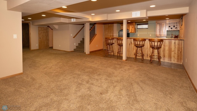2510 10th St N, Fargo, ND 58102 - finished basement featuring bar, carpet, recessed lighting, stairway, and fridge