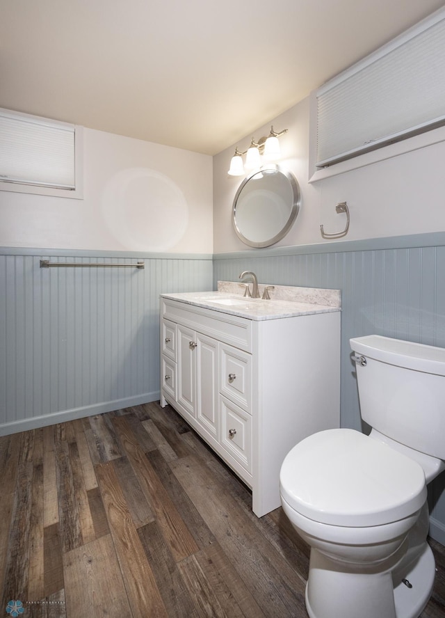 2510 10th St N, Fargo, ND 58102 - bathroom with a wainscoted wall, vanity, and wood finished floors
