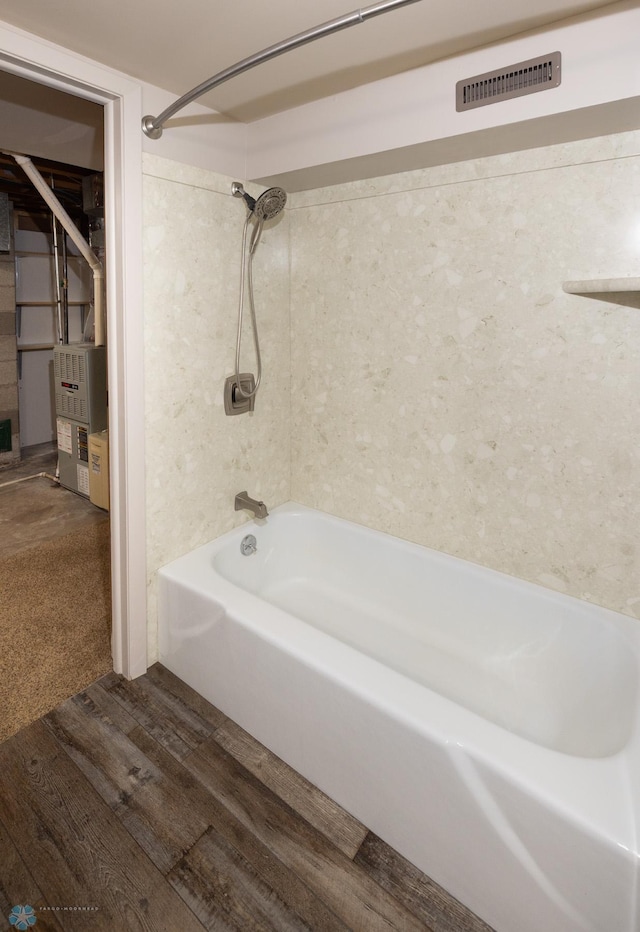 2510 10th St N, Fargo, ND 58102 - bathroom featuring shower / bath combination and wood finished floors