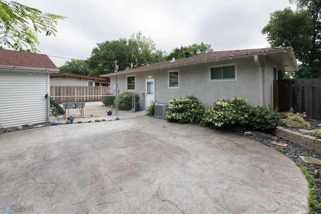 2510 10th St N, Fargo, ND 58102 - back of house with stucco siding and a patio area