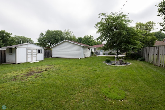 2510 10th St N, Fargo, ND 58102 - fenced backyard featuring a storage unit