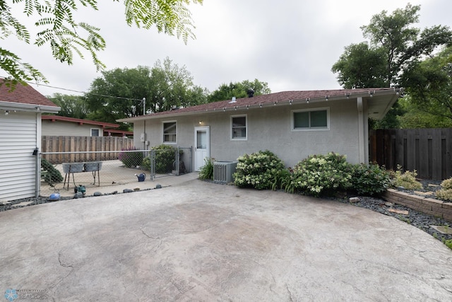 2510 10th St N, Fargo, ND 58102 - back of house featuring stucco siding and a patio