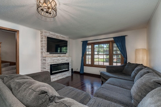433 S Ave, North Mankato, MN 56003 - living area with wood finished floors, a fireplace, a textured ceiling, and stairway