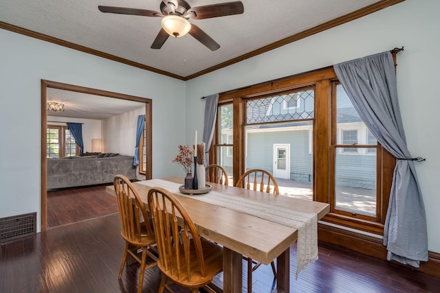 433 S Ave, North Mankato, MN 56003 - dining area with dark wood-type flooring, a ceiling fan, ornamental molding, and a textured ceiling