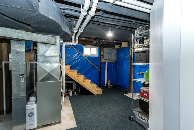 1109 Adams St, Mankato, MN 56001 - basement with heating unit, electric panel, and stairway
